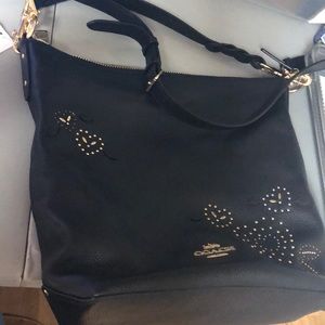 A black Coach purse